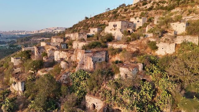 The depopulated, historic village of Lifta in Jerusalem; an aerial view showing the old houses on the hillside.