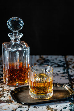 Bourbon in rocks glasses with a decanter 