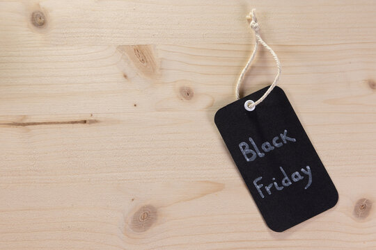 A rectangular black label with a small piece of string on which the words &lsquo;Black Friday&rsquo; are written