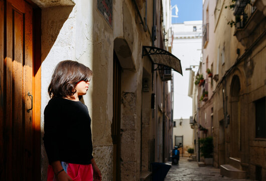 Artistic Light and Shadow Portrait of a Preteen Girl in Altamura