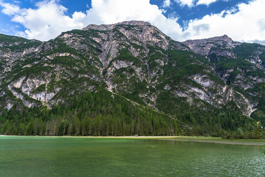 Stunning panorama view of Duerrensee Lake with Dolomites alps in Hoehlensteintal valley on sunny summer day, South Tyrol, Italy
