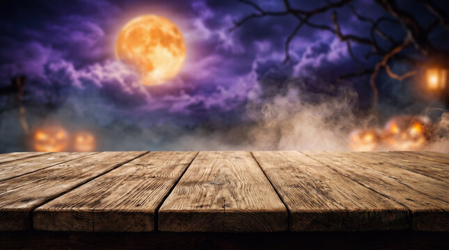 Halloween wooden table with glowing jack o lanterns surrounded by eerie fog, dark haunted forest and dramatic autumn night atmosphere