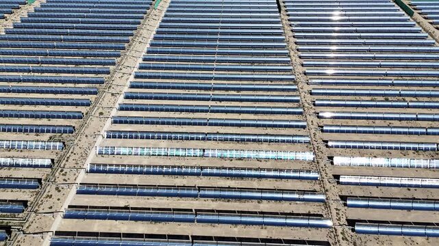 Large scale parabolic trough solar thermal power plant panel array