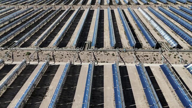 Aerial view of parabolic trough solar thermal power plant arrays