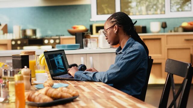 Video game developer tests lobby experience and programming mechanics, using animation and visual effects for entertainment industry. Woman digital nomad works from home in everyday life.