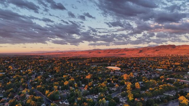 Sunrise over foothills of Rocky Mountains and city of Fort Collins in northern Colorado in late summer scenery