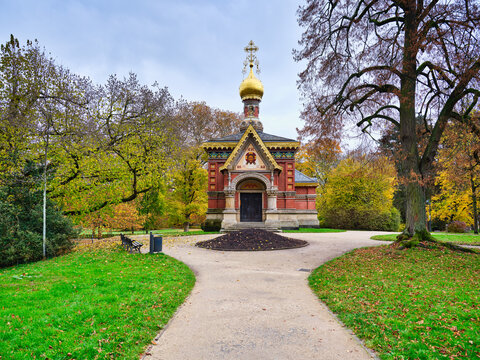 Russian church facade and autumn park path in Bad Homburg