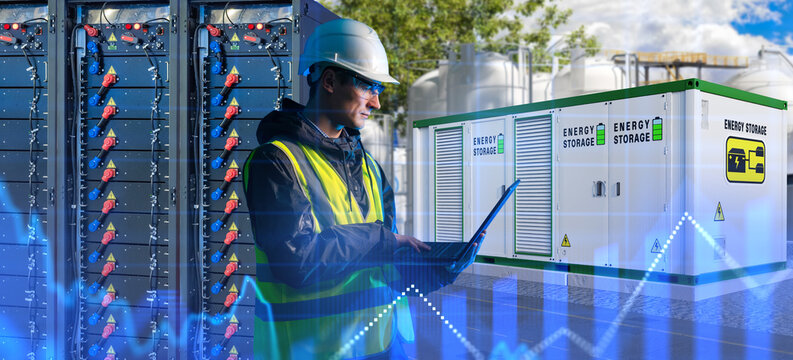 Energy storage industry, engineer monitors battery storage systems and electrical equipment for storing and redistributing generated energy.