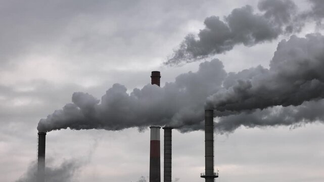 Pollution, industry, smoke pouring out of a factory chimney, Lenzing, Upper Austria, Austria