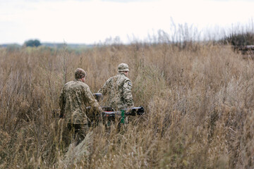 Fototapeta premium Ukrainian soldiers preparing heavy bomber drone for combat mission