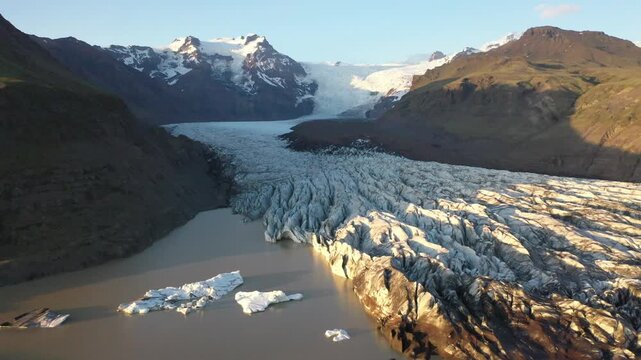 Glacial river in front of Mountains with Hvannadalshn&uacute;kur, aerial view, Sv&iacute;nafellsj&ouml;kull glacier tongue, Vatnaj&ouml;kull glacier, Iceland