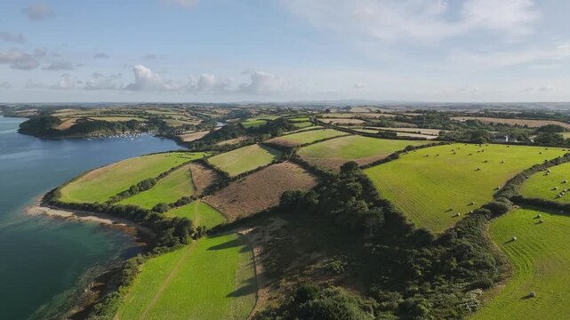 Farms and Fields over St Mawes from drone, Carrick Roads, River Fal, Falmouth, Cornwall, UK