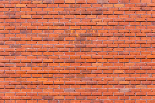 Red brick wall texture background seamless horizontal running bond masonry pattern Seamless background texture of a bright red clinker brick wall with uniform horizontal running bond masonry pattern