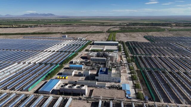 aerial view of large scale parabolic trough solar thermal power station