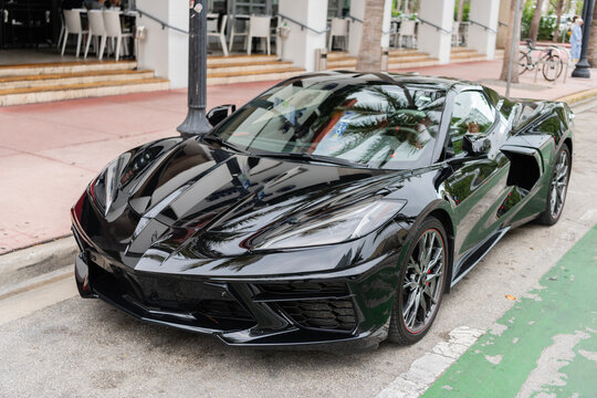 Miami, Florida, USA - May 05, 2025: Chevrolet Corvette C8 2023 sports car. Luxury sport car Chevrolet Corvette. Car Chevrolet Corvette parked outdoor. Black Chevy sportscar, corner view