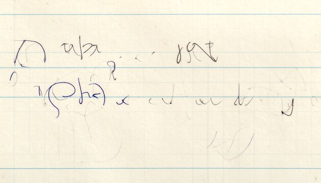 Close up of handwritten text in blue ink on lined notebook paper with faint pencil marks and uneven script