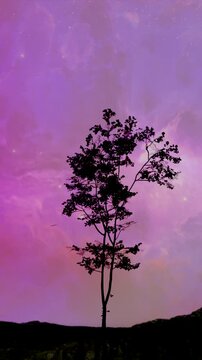 Tree silhouette in the wind vertical