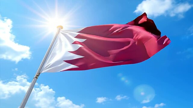 National flag of qatar waving in the wind under bright sun