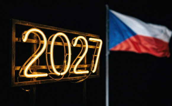 Neon sign displaying the year 2027 with the Czech flag in the background at night, representing future events and celebrations