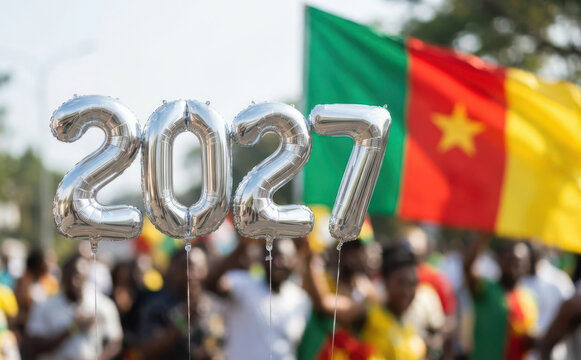 Cameroon celebration with 2027 silver balloons and national flag at a public street parade event