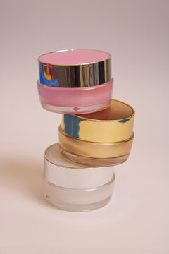 Stacked Cosmetic Cream Jars With Colorful Lids