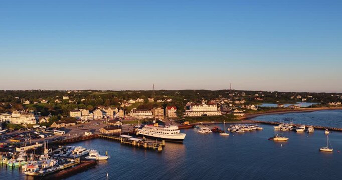 New Shoreham, RI USA - August 15, 2026 - Morning aerial video, backward dolly motion, of Block Island's Old Harbor on a sunny summer day, 4096 x 2160, Frame rate 29.97 fps.