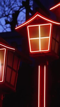 Nakatsukasa Magotaro Inari cyber shrine, Nishi Park, Chuo Ward, Fukuoka City, illuminated staircase with neon lit fox lanterns at night, Kyushu island, Japan, torii gate with cherry blossoms