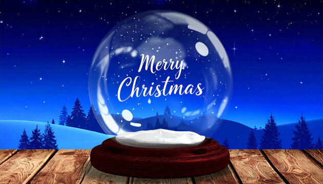 Snow globe displaying merry christmas message on wooden table