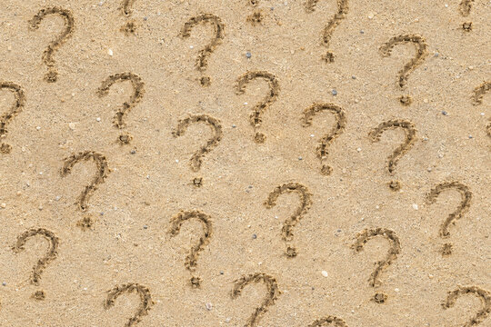 Realistic sand texture featuring hand-drawn question marks carved into fine beach sand, creating a seamless pattern with natural shadows, grains, pebbles, and tactile detail.