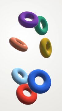 Colorful Ceramic Rings Tumbling Vertical Loop