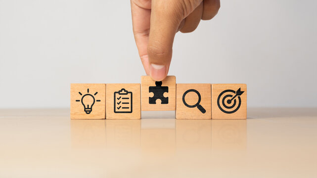 Problem solving workflow concept with IDEA, PLAN, SOLVE, TEST and RESULT wooden blocks representing structured thinking and successful execution.