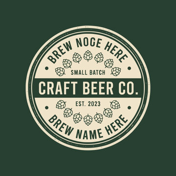 Vintage style craft beer company logo emblem with hop illustrations on dark green background.