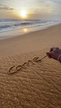 Come Back Written by Hand in Sand as the Ocean Erases the Words