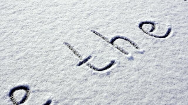 Written SAVE THE PLANET on snow background message ice outdoor on ground in winter. Writing text sign drawing on field in frozen background. Weather changing cold season has arrived environment