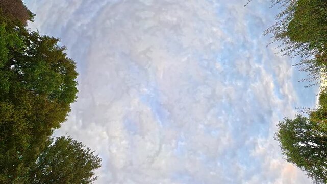Time Lapse Footage of Sky and Dramatic Clouds over England During Car Drive. Car Roof Mounted Footage with Straight Up Position