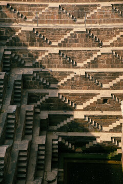 Symmetrical stone staircase inside a historic Indian stepwell