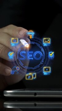 Businessman finger touching glowing SEO text hub node vertical shot with search engine marketing icons. Online website ranking optimization strategy, digital search visibility, and traffic concept.