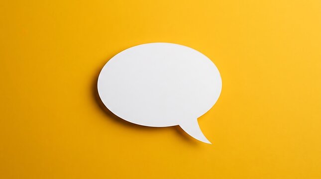 A simple minimalist composition of a clean white speech bubble standing out against a bright solid yellow backdrop ideal for various design