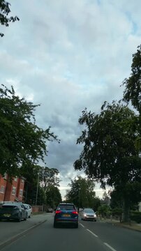 September 4th, 2026. Urban City Streets View of Luton Town of England United Kingdom During Mostly Cloudy Evening. Wide Angle Car Mounted Camera Time Lapse Footage Was Captured During Day Drive. 