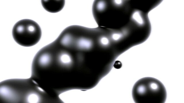 Glossy black liquid drops morphing and flowing dynamically in a modern minimalist studio composition
