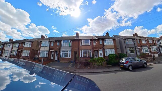 September 4th, 2026. Urban City Streets View of Luton Town of England United Kingdom During Mostly Cloudy Evening. Wide Angle Car Mounted Camera Time Lapse Footage Was Captured During Day Drive. 