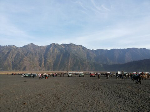 Mount Bromo Volcanic Caldera Landscape with Tourists in East Java Indonesia
