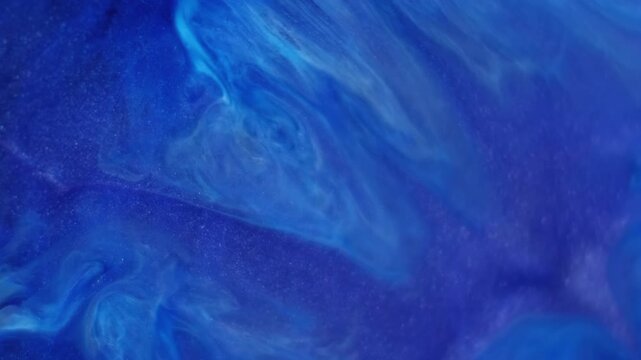 Paint spill. Pigment liquid. Blue acrylic stream mix blend. Color shimmering splatter diffusion abstract emulsion defocused background.