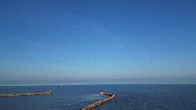 High Angle Drone Camera Footage of Newcastle upon Tyne Beach and Ocean. The Footage Was Captured at Just Before Sunset From Medium High Altitude From Sea Level on 13th October, 2025. 