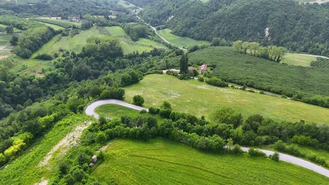 Aerial View of Winding Country Road and Rolling Green Hills