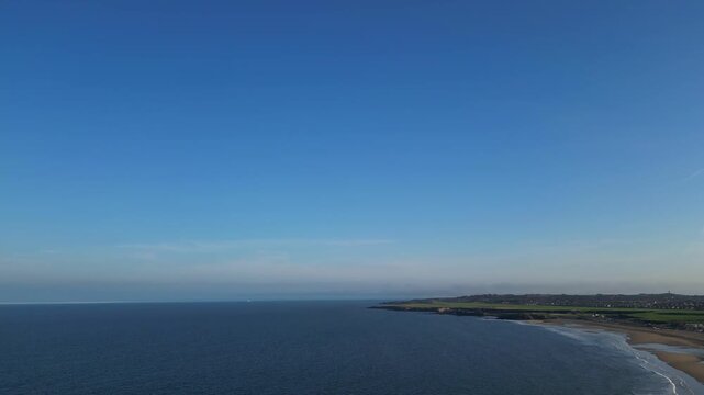 High Angle Drone Camera Footage of Newcastle upon Tyne Beach and Ocean. The Footage Was Captured at Just Before Sunset From Medium High Altitude From Sea Level on 13th October, 2025. 