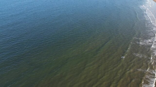 High Angle Drone Camera Footage of Newcastle upon Tyne Beach and Ocean. The Footage Was Captured at Just Before Sunset From Medium High Altitude From Sea Level on 13th October, 2025. 