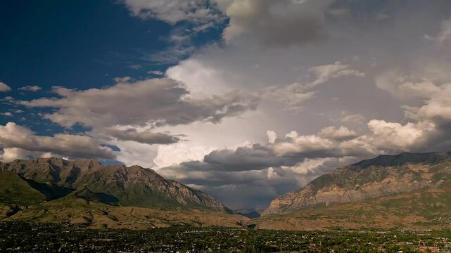 Panning aerial view, looking at the Wasatch Mountains from Orem, Utah after a storm moved through the valley.