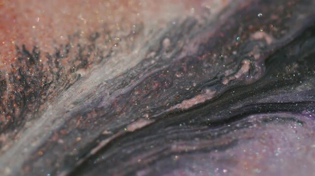 Paint stream blur. Glitter texture. Orange color dye curl blending in gray black sparkling art flare fluid wavy abstract background.