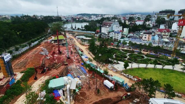 Aerial view of construction site development with machinery in urban cityscape  Dalat, Vietnam,